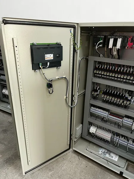 Inside the Al Mirfa RTU panel, showing the controller rack, terminals and control wiring