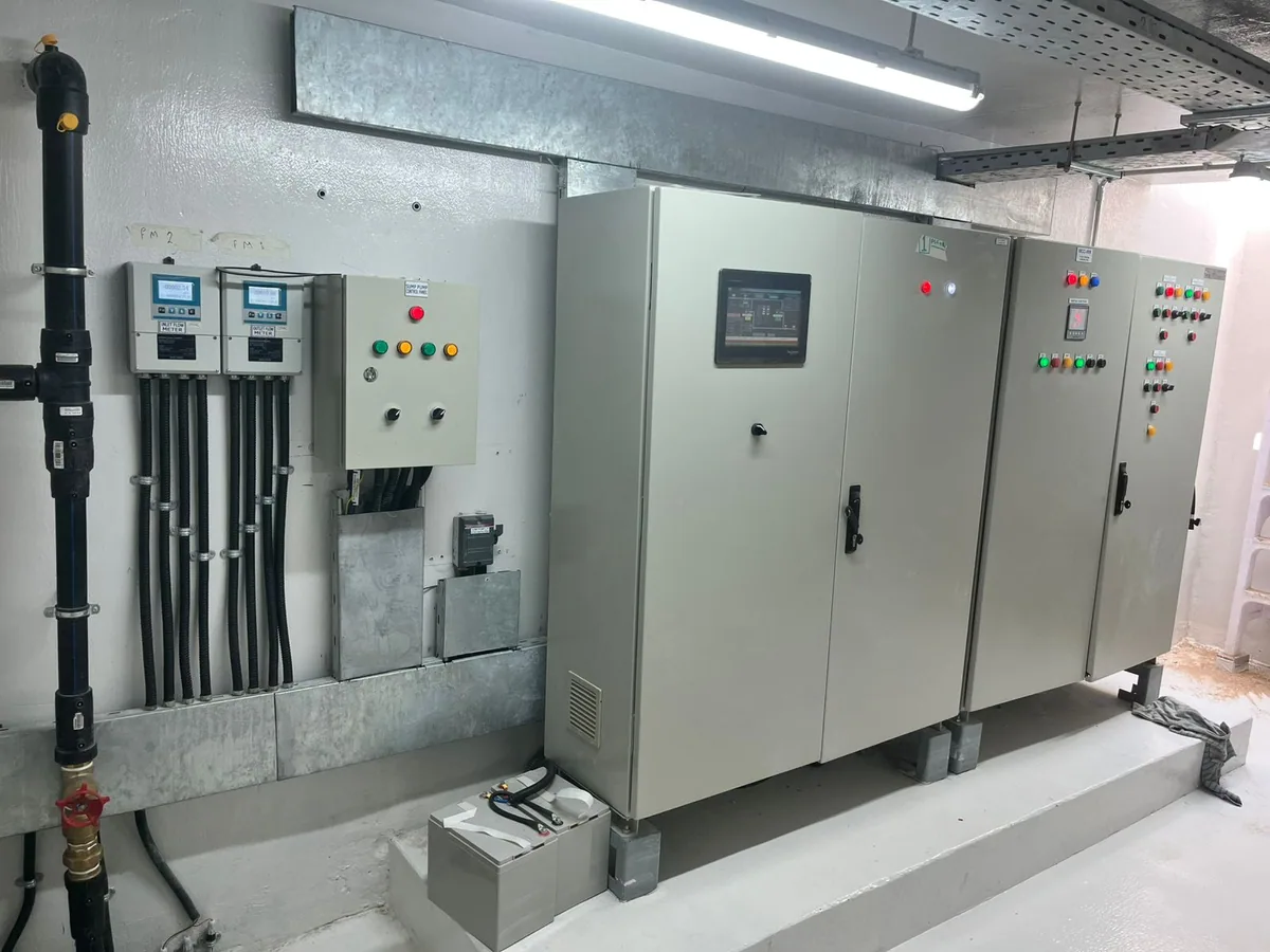 Pump room with inlet and outlet flow meters, sump pump control panel and the motor control centre with its HMI
