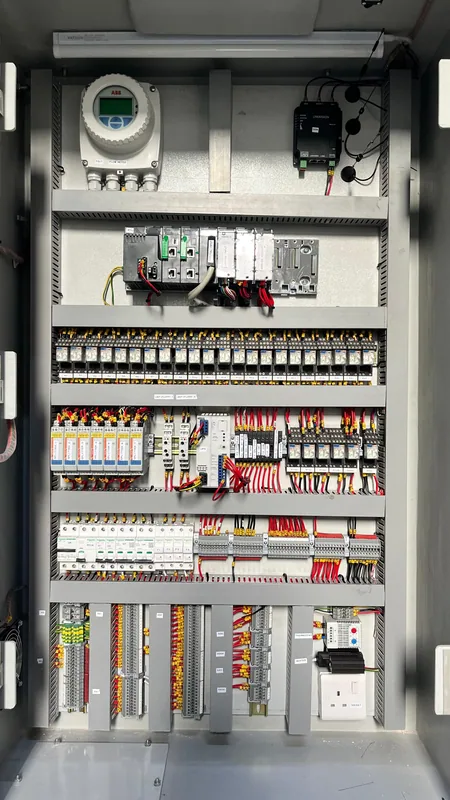 Inside the kiosk RTU panel, showing the controller, DC UPS and field terminals