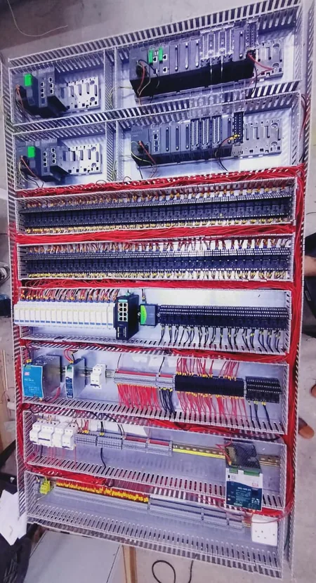 Motor control centre for the Bawabat Al Sharq pumping station under assembly, showing drive and control wiring