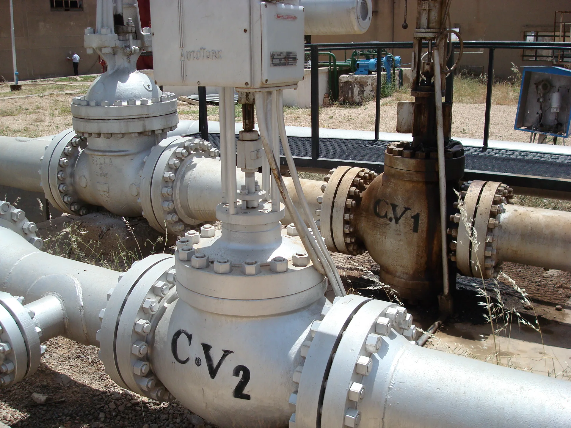 Actuated control valves with electric actuators on a pumping station manifold