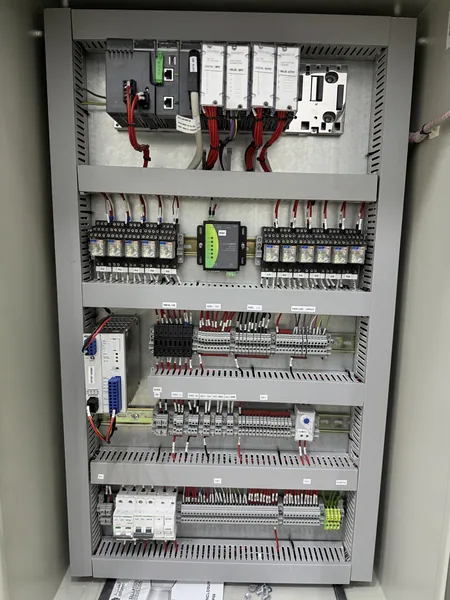 Inside the Falaj Hazza PLC panel, showing the controller, I/O modules and terminals