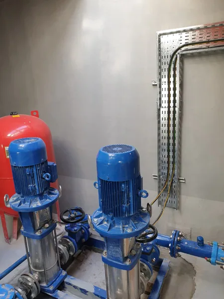 Duty and standby irrigation pumps with pressure vessel in a park pump room, Al Fou'ah, Al Ain